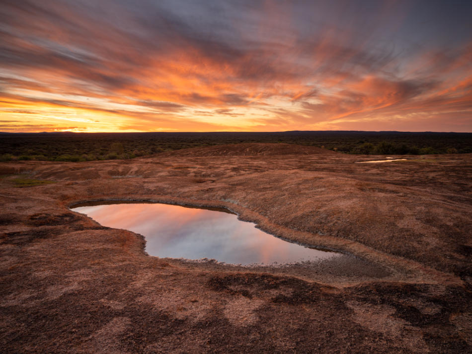 Colors of the sunset reflecting off the water's surface.