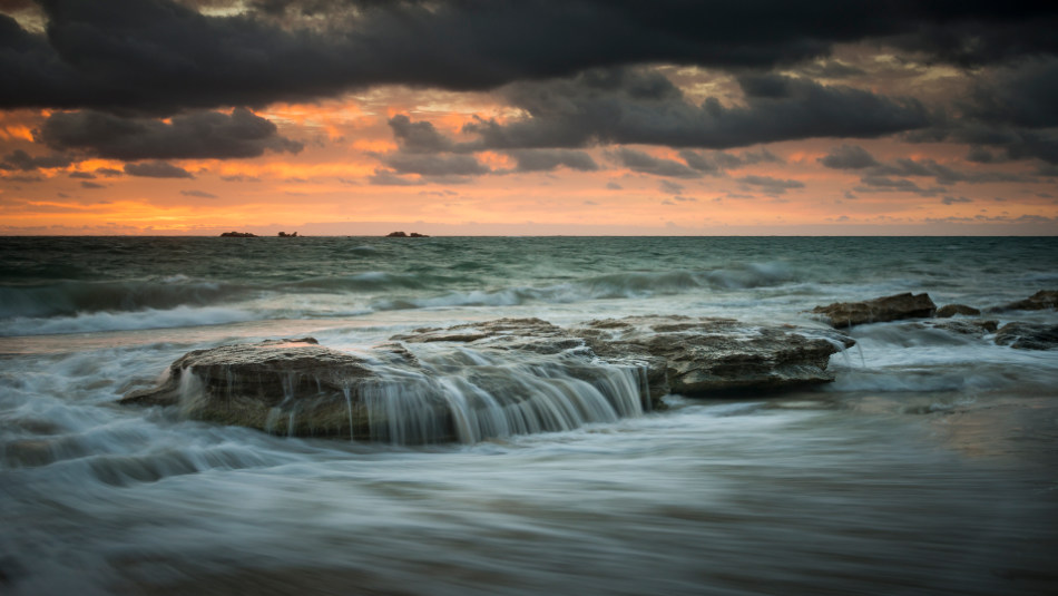 Using an ND filter to slow the shutter speed to 1/4 of a second captures the water cascading over the rocks