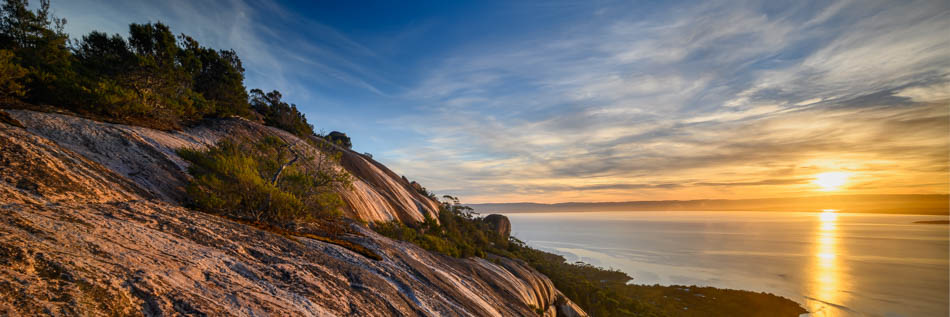 The angle of the sunlight draws out the texture in the rock face